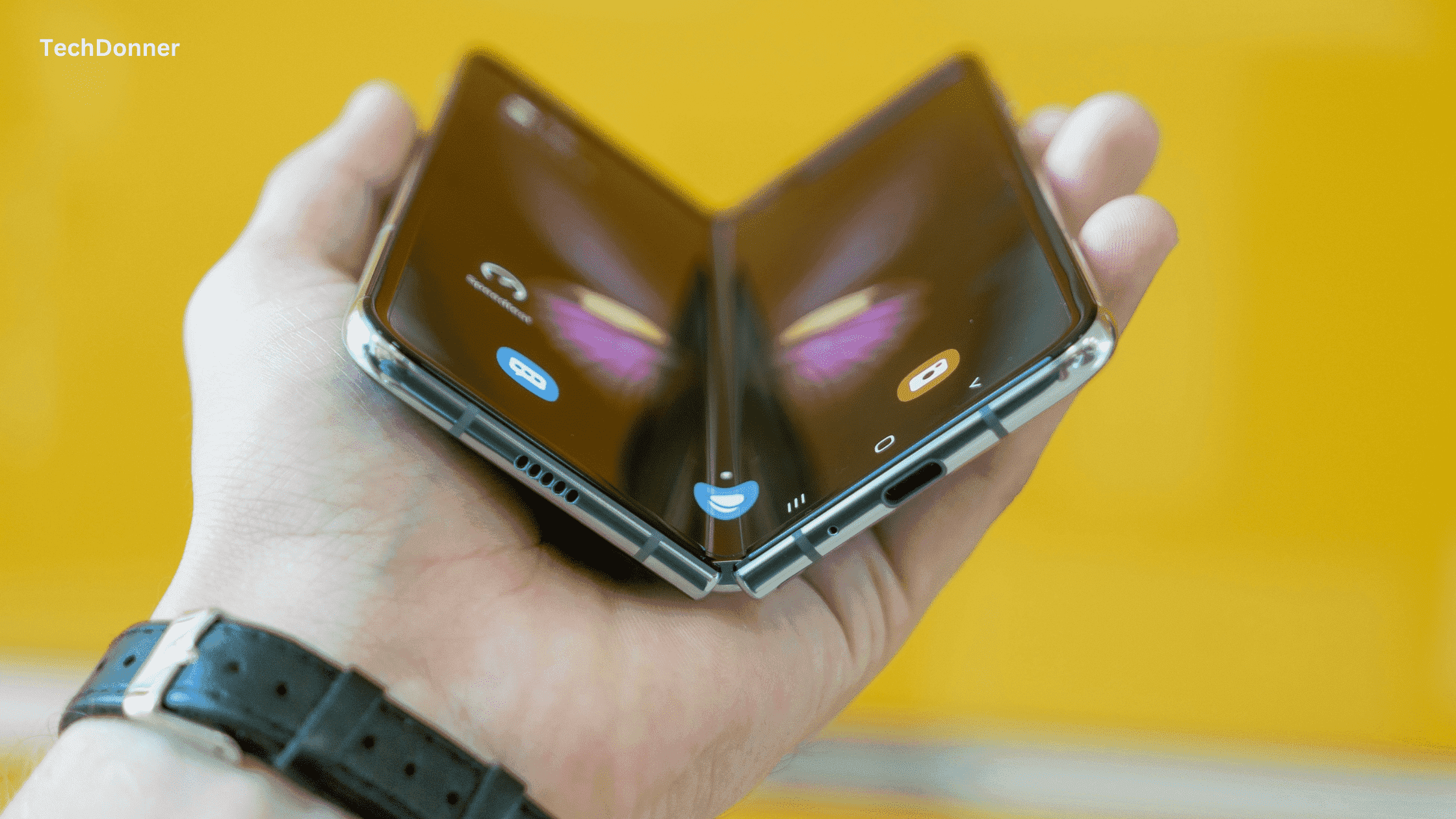 an image of holding a samsung galaxy fold mobile